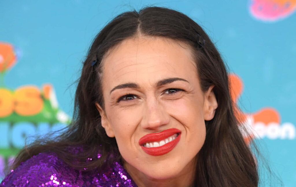 Colleen Ballinger as Miranda Sings in vibrant blue background wearing purple sparkly outfit Wallpaper