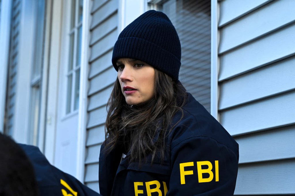 Missy Peregrym as FBI Special Agent Maggie Bell in navy jacket and beanie residential background Wallpaper