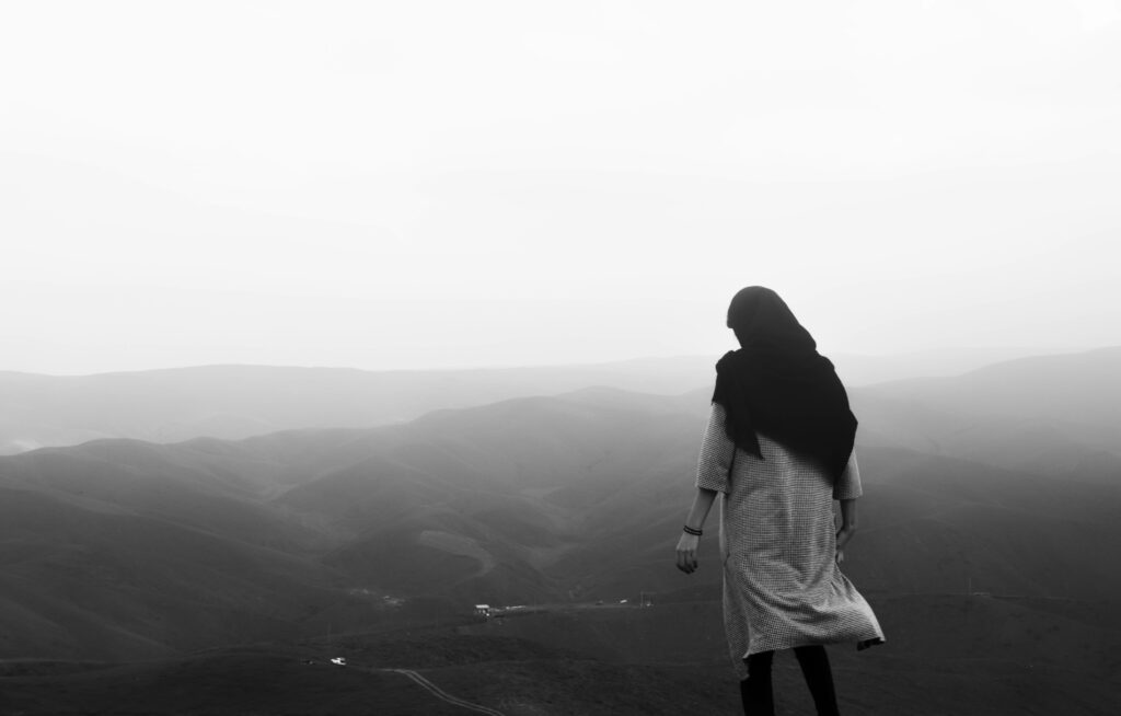 Solitary Soul Amidst Enchanting Misty Peaks: Forever Alone in Monochrome Wallpaper