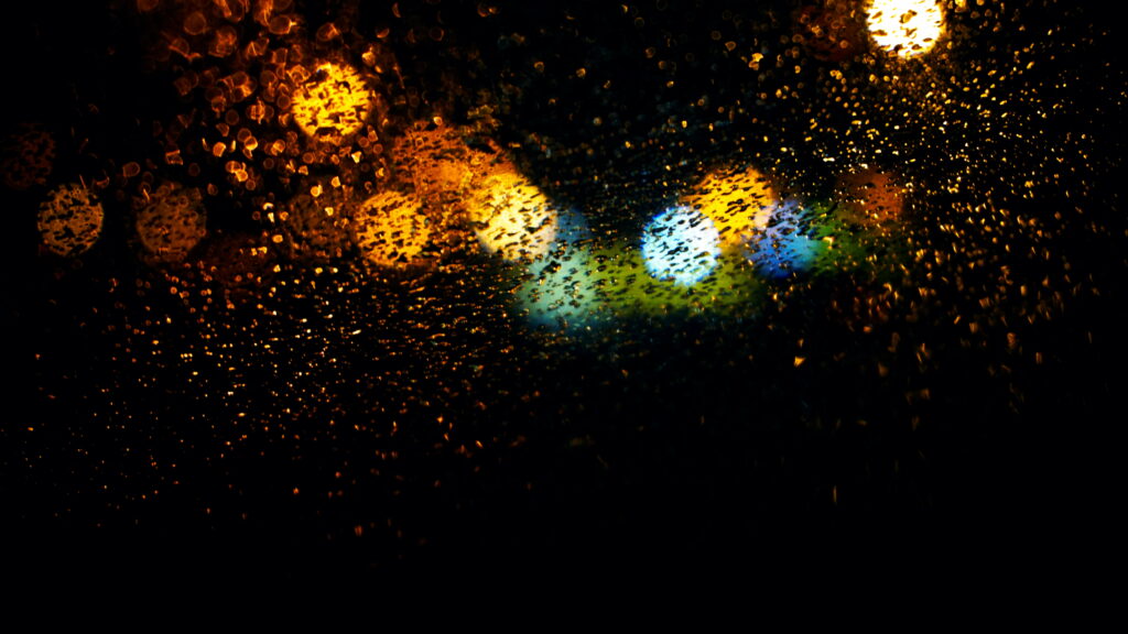 Rainy Blooms: A Mesmerizing Bokeh Rainfall in a 5K Wallpaper