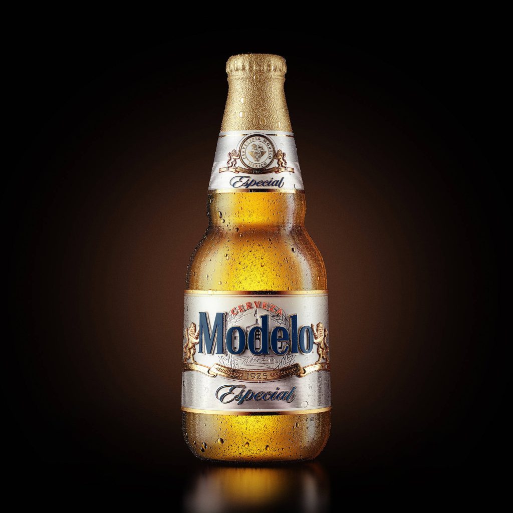 Chilled Modelo Especial beer bottle glistening with condensation on dark moody background wallpaper