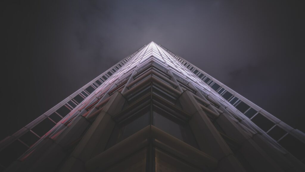 Moody Night Wallpaper: Modern Architectural Facade with Geometric Lines
