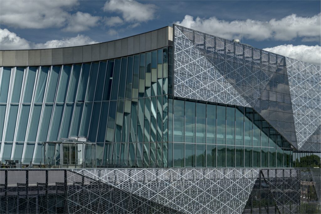 Modern Architectural Facade Wallpaper with Expansive Glass Windows