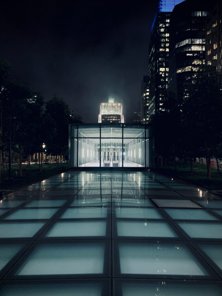 Modern Glass Building Wallpaper: Nighttime Urban Architecture