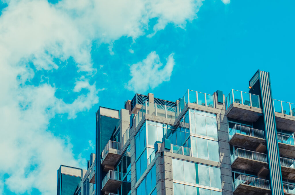 Modern Architectural Wallpaper: Sleek Building with Glass Balconies