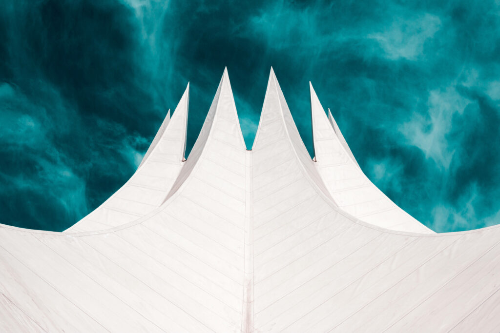 Modern Wallpaper: White Triangular Peaks & Teal Sky Background