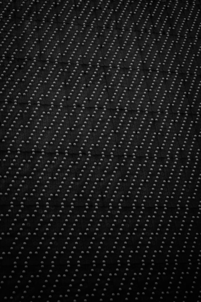 Modern Black Textured Wallpaper with Diagonal Raised Dots