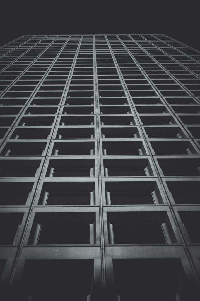 Modern Black and White Wallpaper of Tall Building's Facade