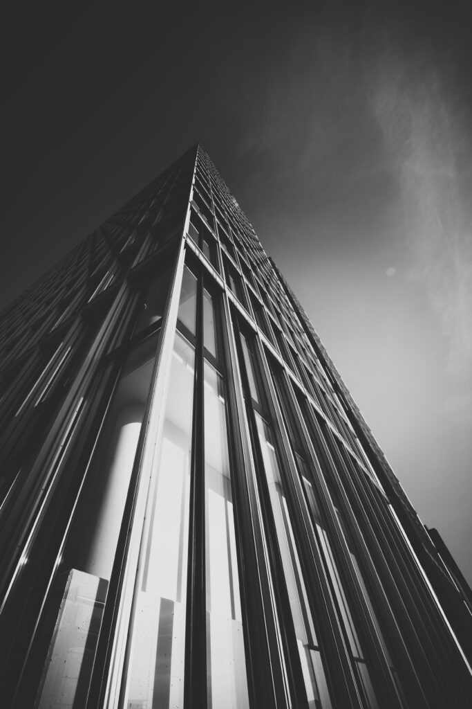 Dynamic Black and White Wallpaper: Modern Building from Low Angle