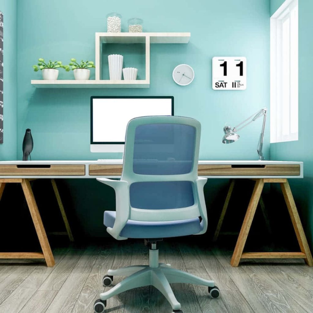 Bright home office with blue walls modern mesh chair and minimalist wooden trestle desk Wallpaper
