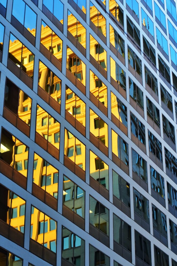 Modern Glass Facade Wallpaper: Golden Geometry Reflection Background
