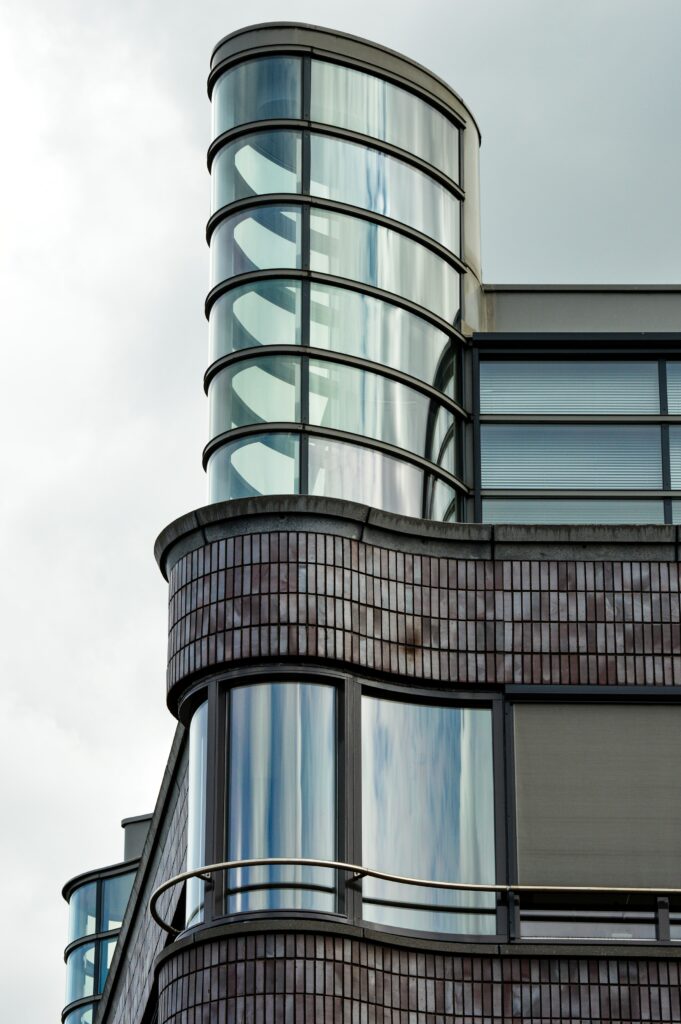 Modern Building Facade Wallpaper: Sleek Glass & Brick Design