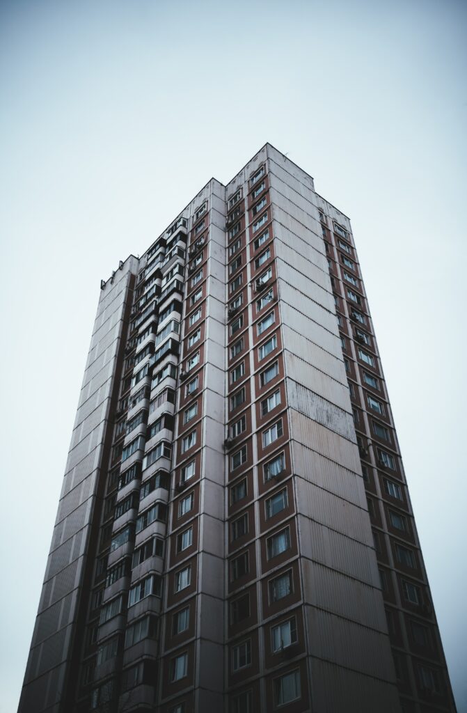 Modern Building Wallpaper: Sleek Architecture Against Tranquil Sky