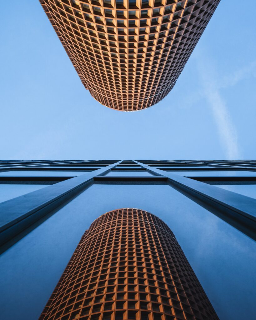 Modern Building Wallpaper: Unique Facade Reflected in Glass