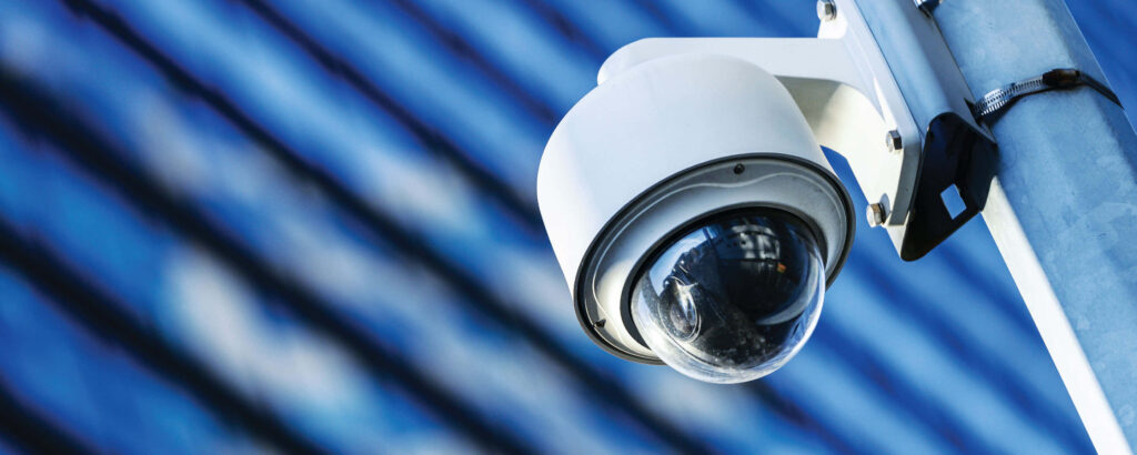 HD Wallpaper of Modern CCTV Camera on Pole with Blue Background