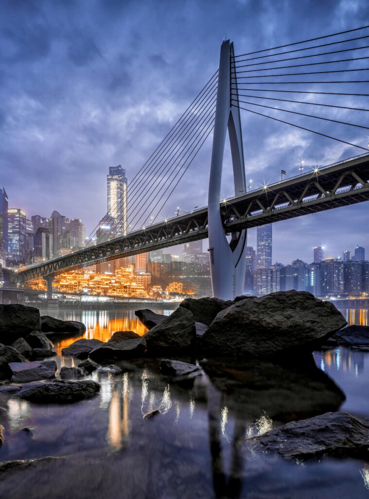Stunning Cable-Stayed Bridge Wallpaper with Serene Cityscape Background
