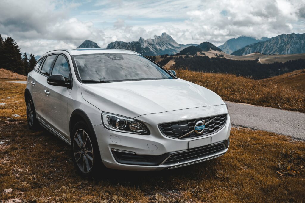 Sleek Modern Car Wallpaper with Stunning Mountainous Background