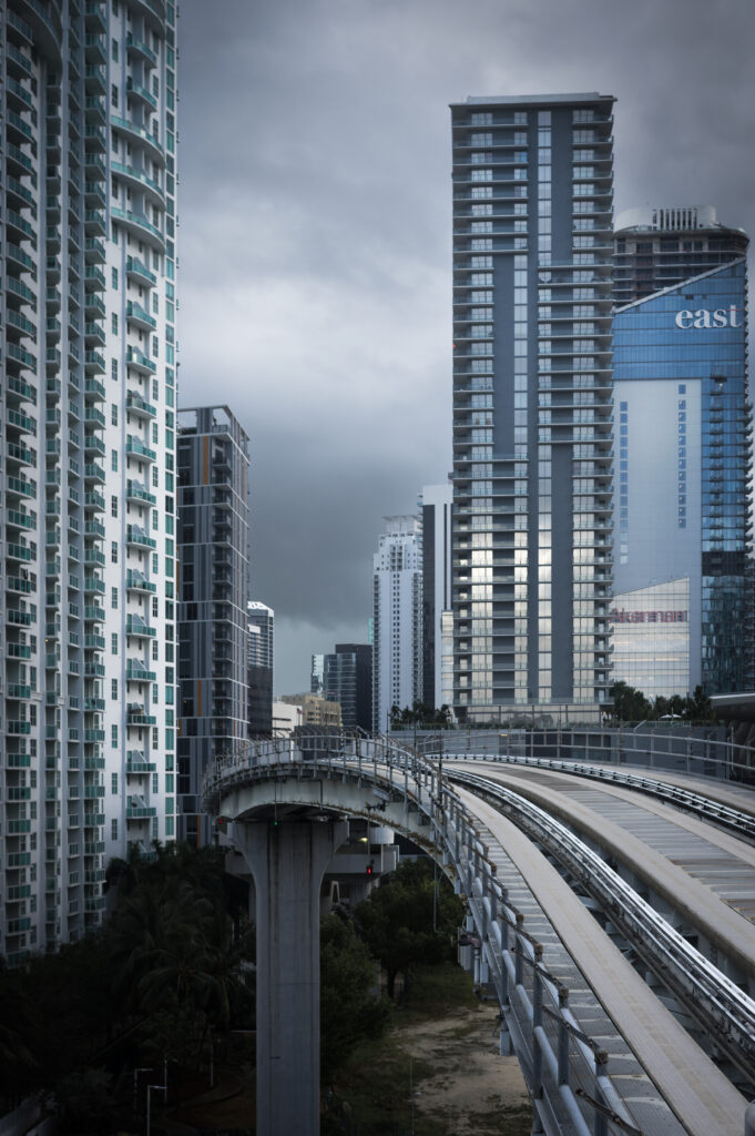 Modern Cityscape Wallpaper: Sleek Buildings & Curved Bridge Background