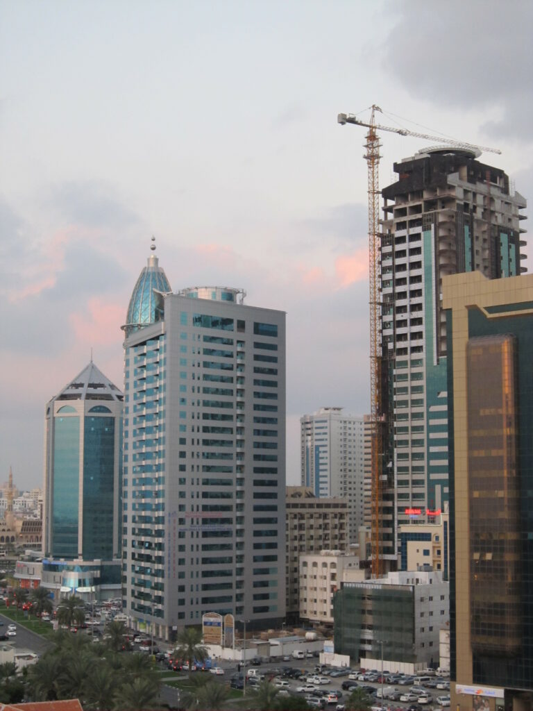 Modern Twilight Cityscape Wallpaper: Skyscrapers & Urban Activity