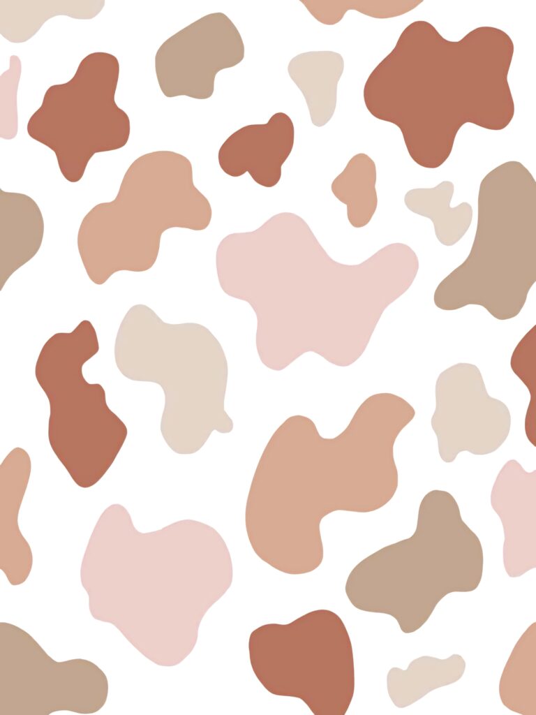 Playful cow print wallpaper with beige tan brown and blush spots on white modern animal pattern
