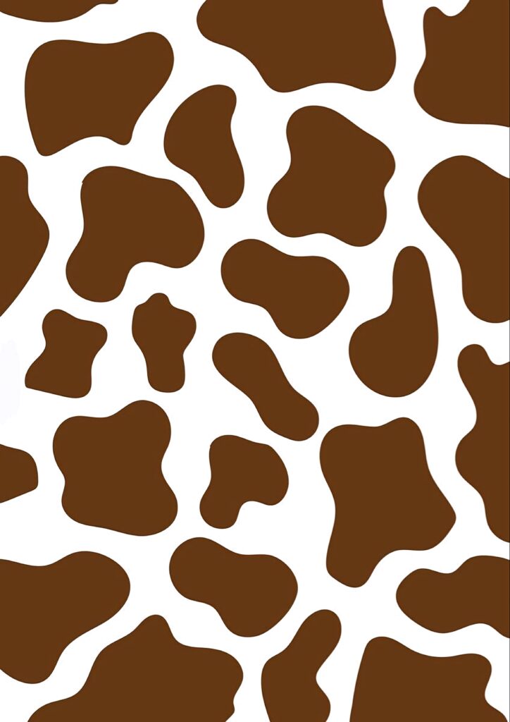 Cow print wallpaper with bold brown patches on white background modern rustic animal pattern