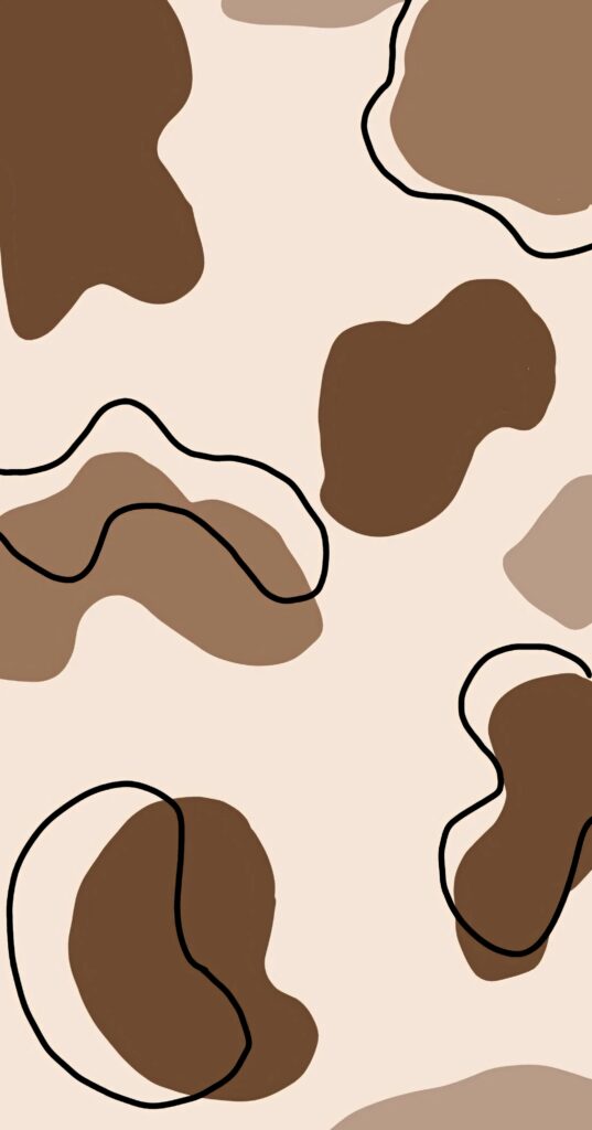 Abstract cow print wallpaper with irregular brown patches on cream for rustic modern decor