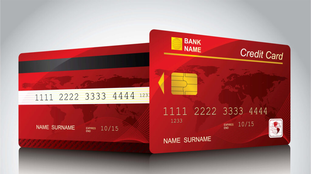 Modern credit card with world map gold chip on vibrant red gradient background wallpaper