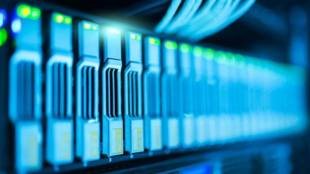 Modern data center with illuminated server racks and blue tones showcasing advanced technology Wallpaper