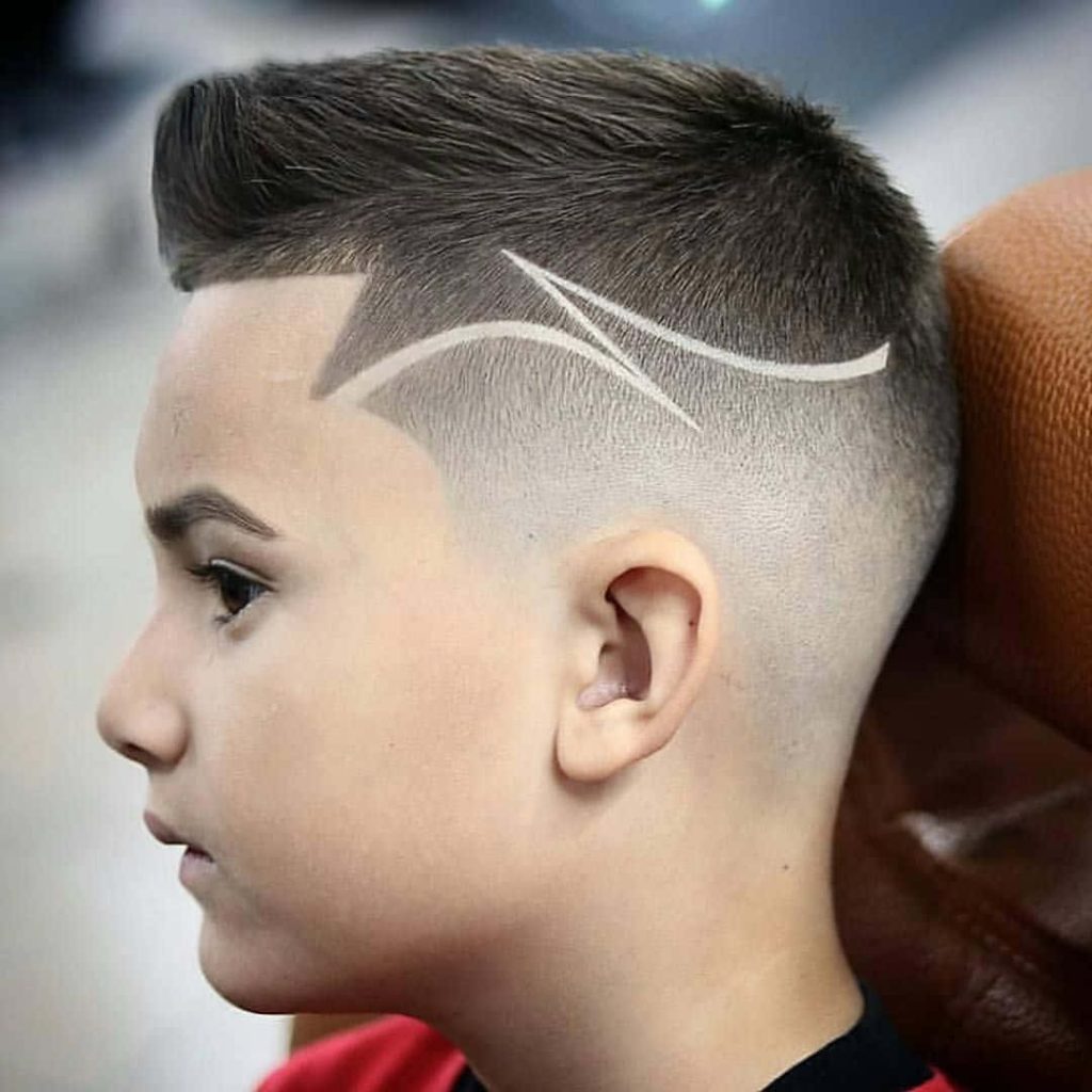 Close-up of modern fade haircut on boy with sharp razor line design stylish short hairstyle Wallpaper