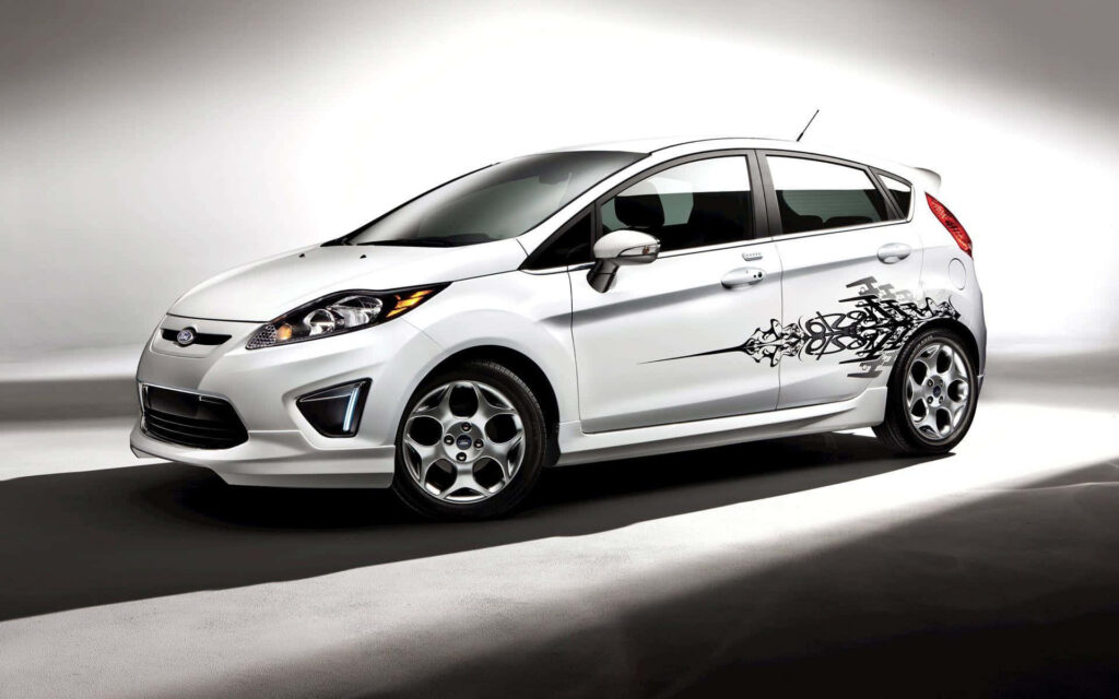 Modern Ford Fiesta in studio with dynamic design and stylish side graphics wallpaper background