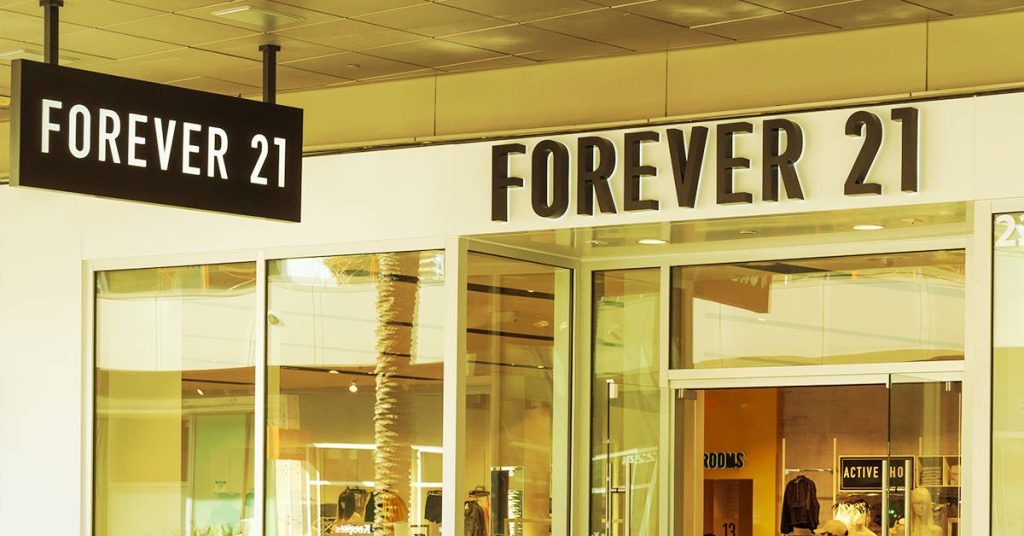 Modern Forever 21 storefront with glass windows and vibrant interior displays wallpaper background