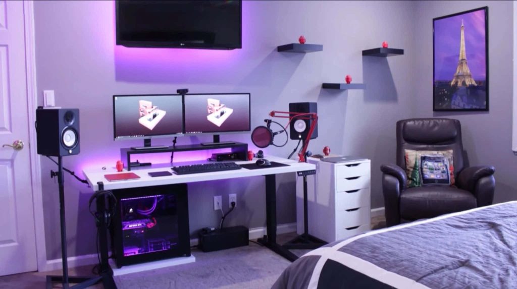 Modern gaming room with dual monitors high-end PC purple LED lighting leather recliner and Eiffel Tower art Wallpaper