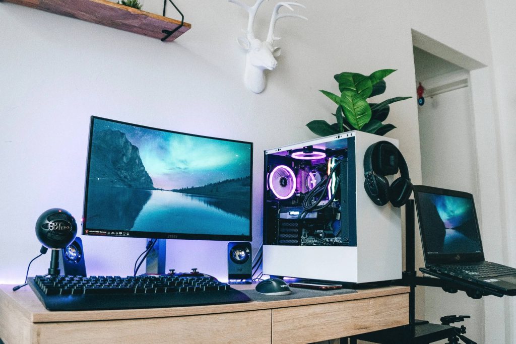 Modern gaming room wallpaper with MSI monitor white PC purple RGB Blue Snowball mic laptop desk