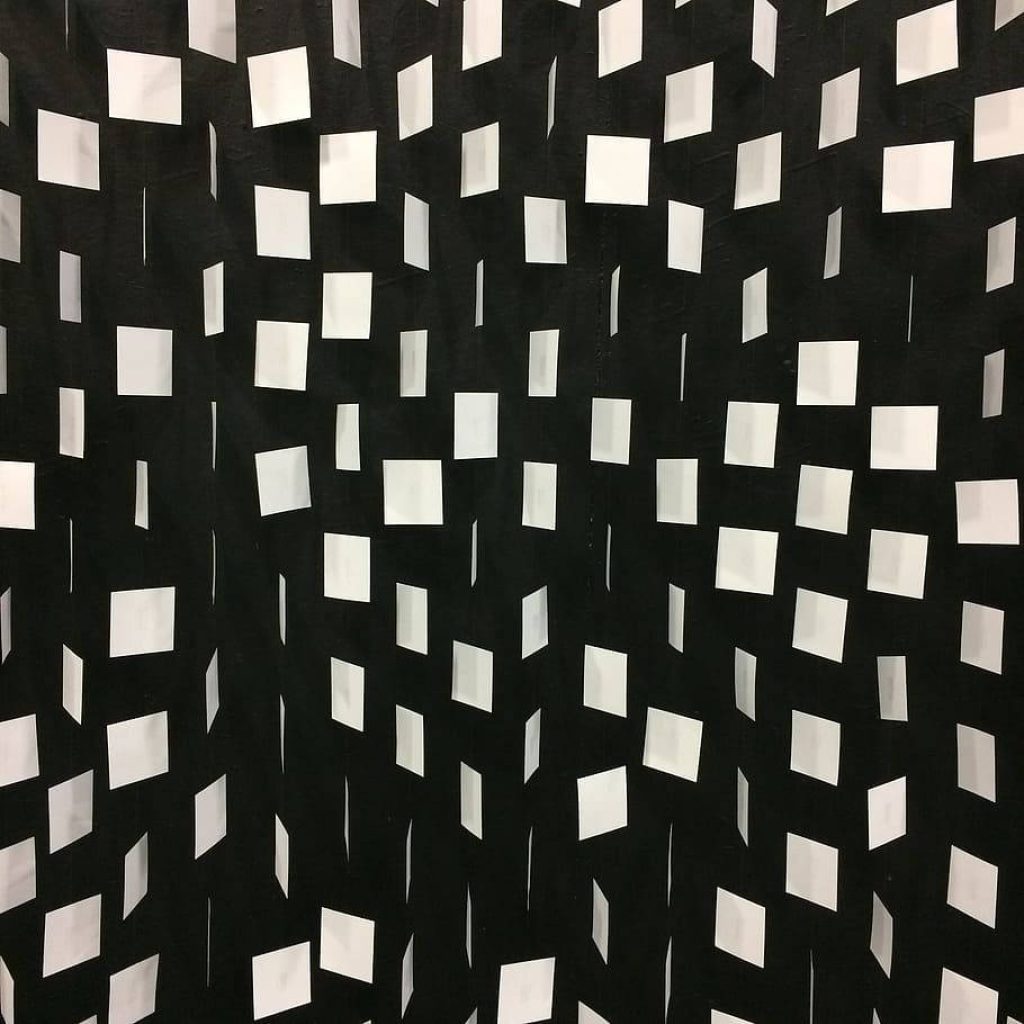 Modern geometric wallpaper with white squares on black background for minimalist interiors