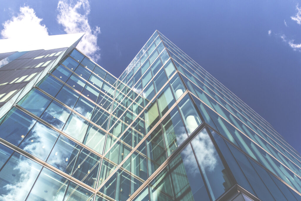 Modern Glass Building Wallpaper: Reflective Architectural Beauty