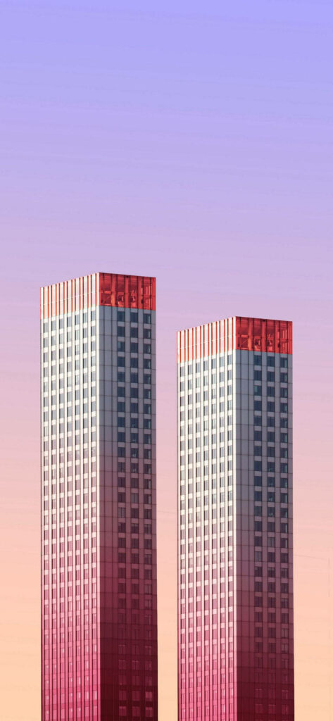 Elegant Pink-Purple Gradient Wallpaper with Tall Buildings & Skyline