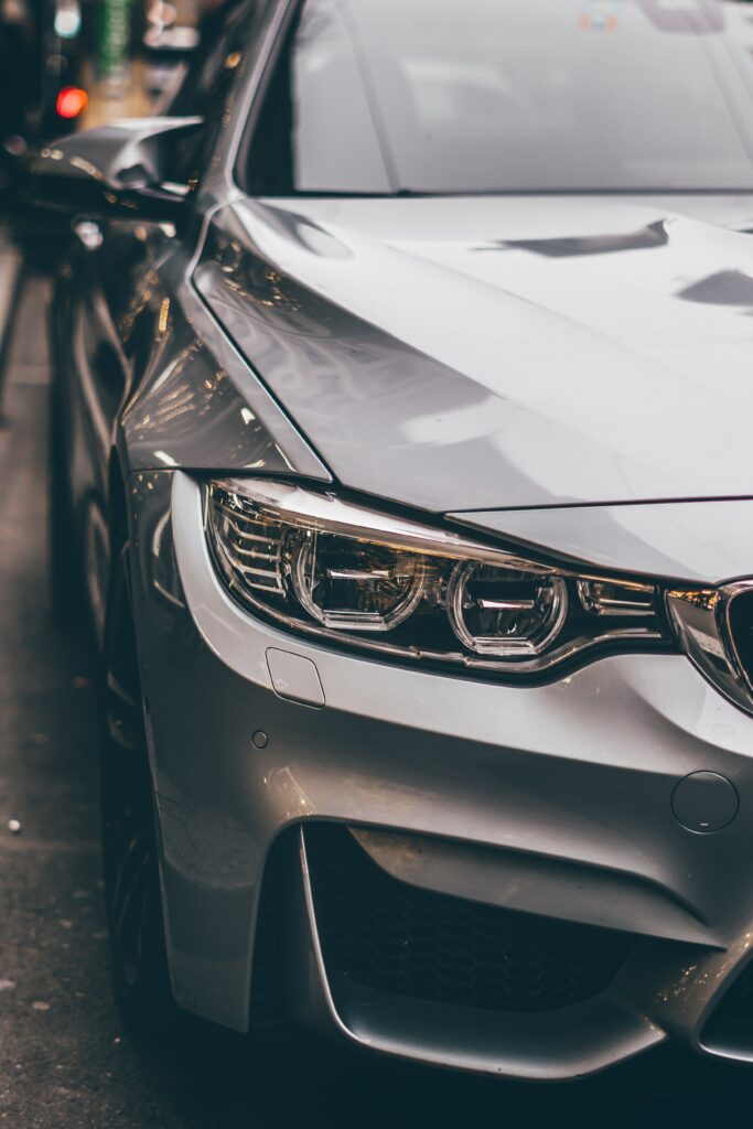 Stylish Gray Car Wallpaper: Dynamic Front View & Modern Design