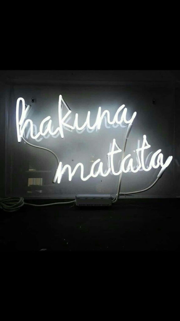 Modern Hakuna Matata Neon Wallpaper on Dark Background