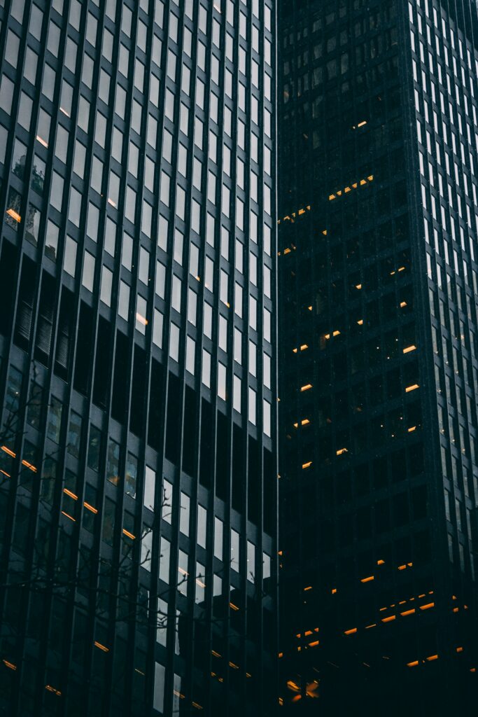 Modern High-Rise Glass Building: Urban Ambiance Wallpaper Background