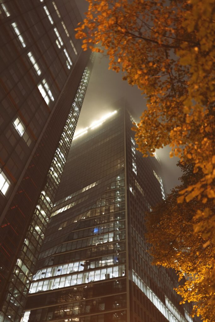 Autumn Misty Wallpaper: Modern High-Rise with Trees Design
