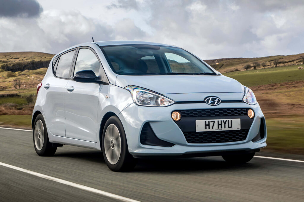 Elegant Hyundai Car Wallpaper: Modern Design on Scenic Open Road