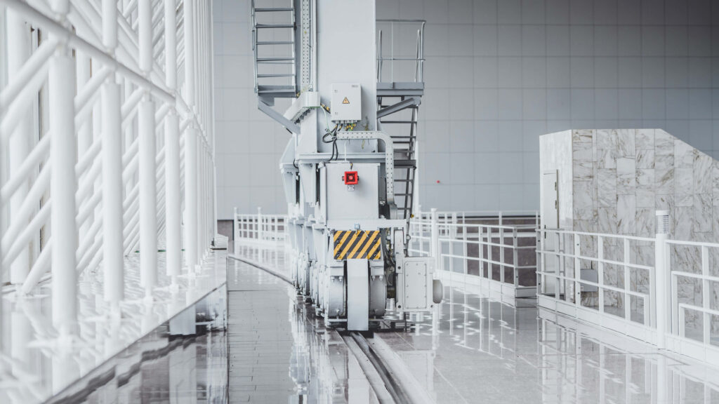 Modern industrial factory wallpaper with metallic white tones polished floors and geometric railings