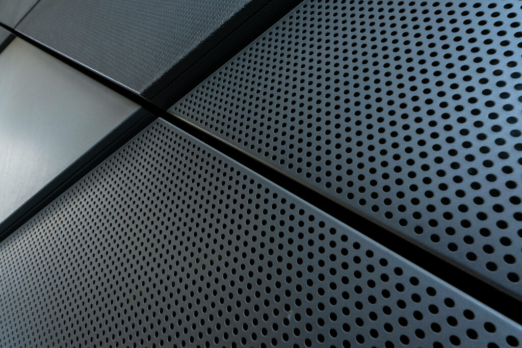 Modern Industrial Wallpaper: Sleek Metal Texture with Uniform Perforations