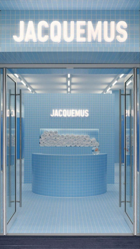 Jacquemus store interior wallpaper in baby blue with modern tiled walls and minimalistic design