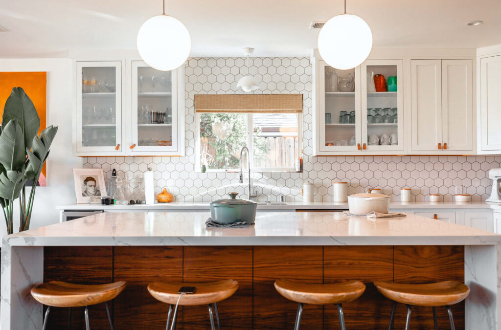 Modern Kitchen Oasis: A Stunning Island and Stools Setup Wallpaper