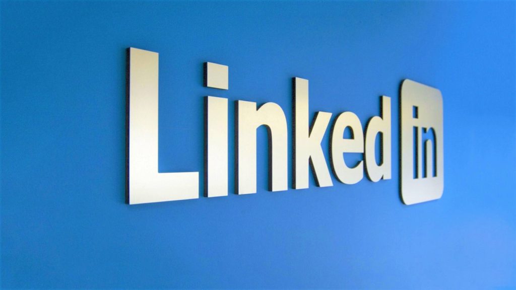 3D white LinkedIn lettering on vibrant blue background professional corporate wallpaper design