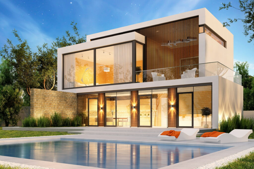 Modern luxury villa at dusk with illuminated pool lush landscaping and starry sky wallpaper background