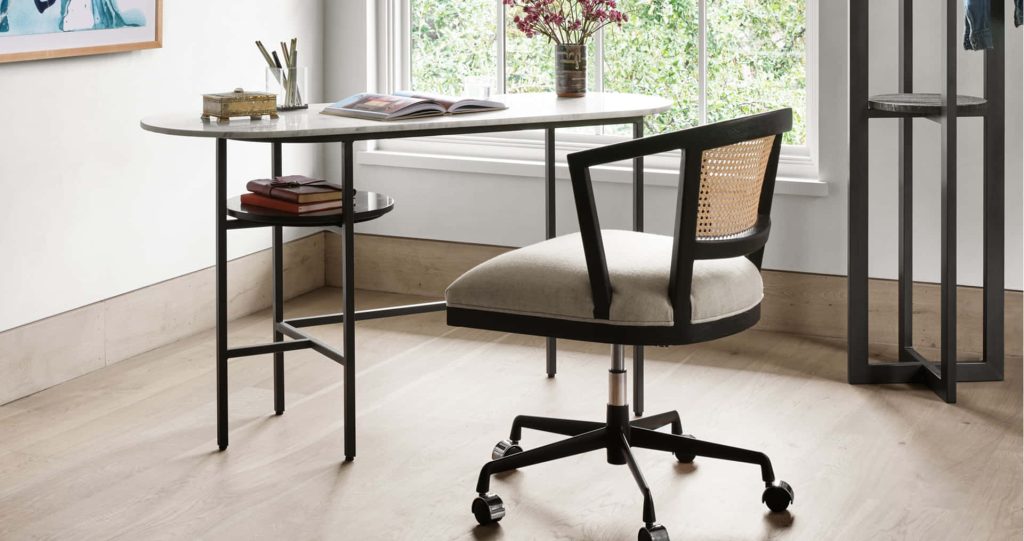 Minimalist home office Zoom background with marble desk cane-back chair and natural lighting Wallpaper
