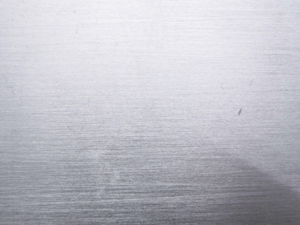 Sleek Metal Texture Wallpaper with Fine Horizontal Brush Strokes