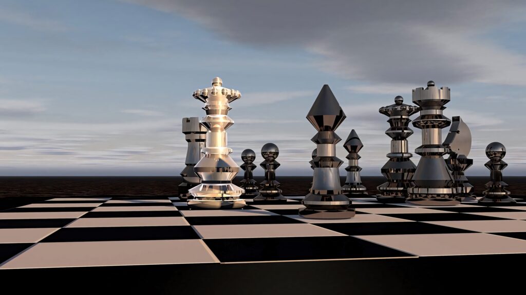 Minimalist metallic chess pieces on clear board with serene sky background wallpaper design